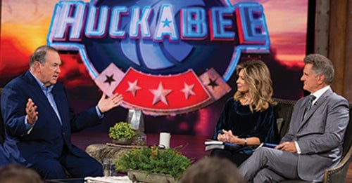 Mike Huckabee with Matt and Laurie Crouch Mike Huckabee with Matt and Laurie Crouch