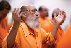 Prisoners praise God during TBN 2nd Chance prison outreach service.